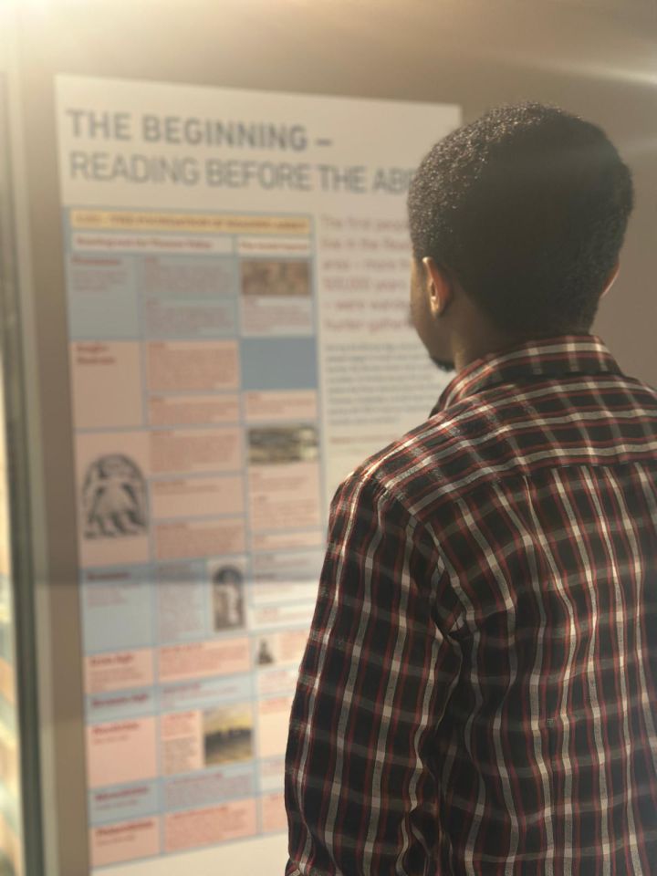 Feranmi Adeoye looking at a museum display